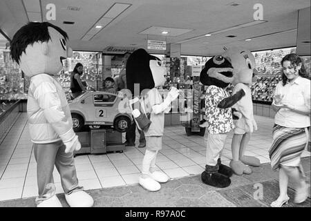 MONTERREY, NL/MEXICO - NOV 2, 2003: People in costumes, dancing to the rythm of loud music,  attract people to enter the shoe store Stock Photo