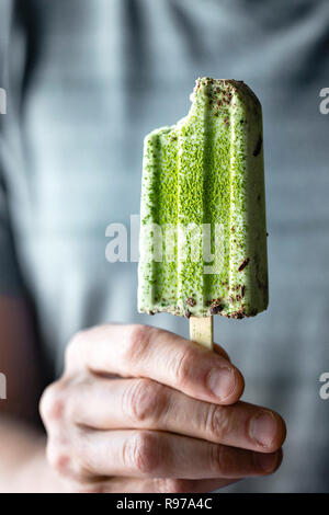 Matcha and  mint chocolate chip popsicles Stock Photo