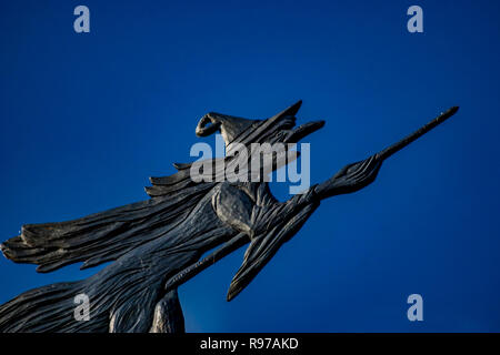 Metal weather vane looking like a witch on a broom Stock Photo