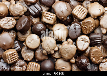 Background of a variety of milk and dark chocolate candies.