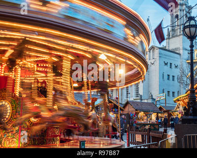 Moving Merry Go Round at the Christmas Market in Millennium Square Leeds West Yorkshire England Stock Photo