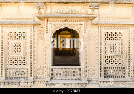 Intricately carved window of Adeshwar Nath Jain temple, Amar Sagar, Jaisalmer, Rajasthan, India Stock Photo