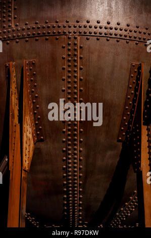 Rivets close-up along metal storage tank creating a design element Stock Photo