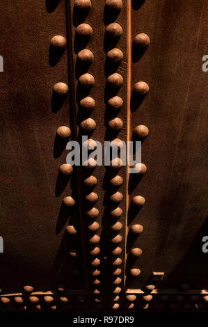 Rivets close-up along metal storage tank creating a design element Stock Photo