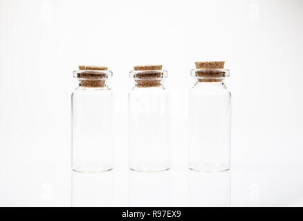 Empty little bottles with cork stopper on white background Stock Photo