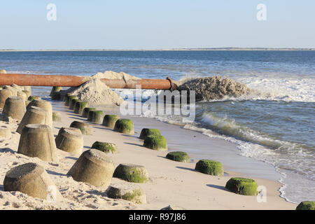 The coastline of the Island of Sylt is perpetually changing by storm, waves and erosion. The further land loss shall be prevented by sand replenishmen Stock Photo