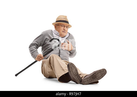 Full length shot of an elderly man on the ground having a heart attack isolated on white background Stock Photo