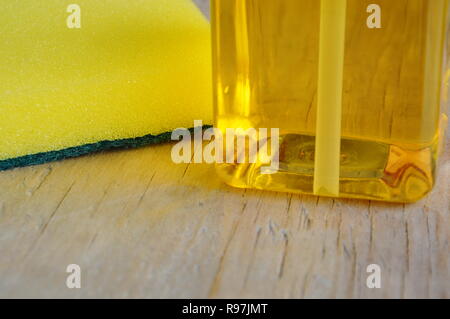 yellow dish washing soap bubble in pump bottle Stock Photo