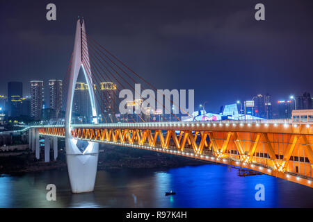 This is a night view of the famous Qiansimen bridge, a popular travel destination along the Jialing river Stock Photo