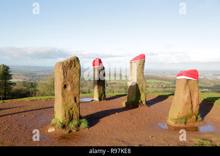 The four stones (three wearing Santa hats) on the Clent hills, Worcestershire, England, UK. Stock Photo