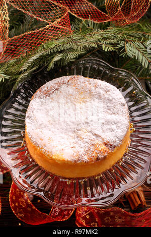 Traditional christmas cheese cake on wooden background Stock Photo