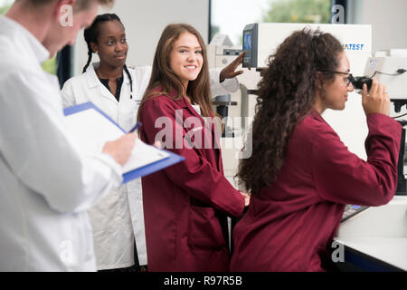 Students in the Loughborough University STEMLAB building  operating hardness testing equipment UK Stock Photo