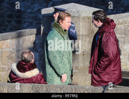 Josh O'Connor and Ben Daniels film a scene for the Netflix drama at Caernarfon Castle. Prince Charles is welcomed to Caernarfon Castle by Anthony Armstong-Jones, Lord Snowdon the Constable of Caernarfon Castle, ahead of his investiture.  Featuring: Ben Daniels, Josh O'Connor Where: Caernafon, Gwynedd, United Kingdom When: 18 Nov 2018 Credit: WENN.com
