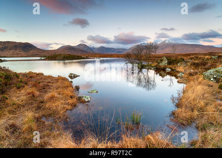 Winter sunrise over Lochan na h Achlaise at Glencoe in the Highlands of Scotland Stock Photo