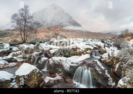 Snow at Buachaille Etive Mor waterfall near Glencoe in the highlands of Scotland Stock Photo