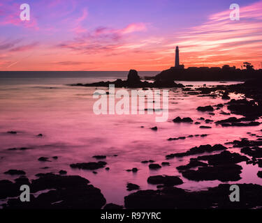 Sunset landscape at Pigeon Point Lighthouse on the Pacific Ocean coastline, Pescadero, California; long exposure Stock Photo