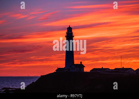 Fiery sunset at Pigeon Point Lighthouse State Park on the Pacific Ocean coastline, Pescadero, California Stock Photo