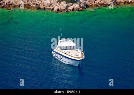 Yacht anchored in hidden turquoise bay of Croatian archipelago, Island of Hvar, Dalamtia, Croatia Stock Photo