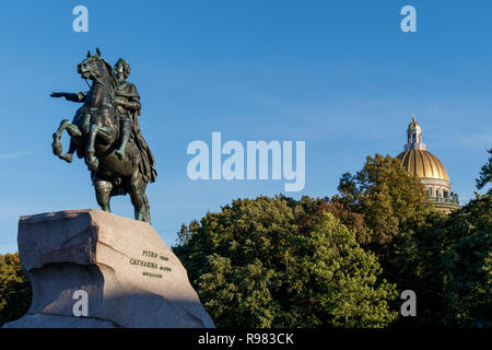 The Brinze Horseman and Thunder Stone pedestal statue of Peter the Great in Senate Square with St Isaac's Cathedral beyond, St Petersburg, Russia. Stock Photo