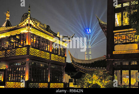 Light show on Shanghai Tower in Pudong seen from Old City's Huxinting Tea House in Shanghai. Stock Photo