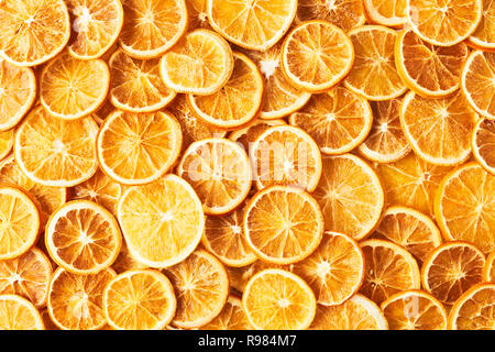 Natural dried oranges or dried grapefruit background. Sliced and dried candied citrus fruit background. Food background. Top view with copy space for  Stock Photo