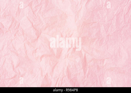 Crumpled pink paper or pink paper texture pattern background. Paper for interior and exterior decoration or background for handcrafts. Abstract rose p Stock Photo