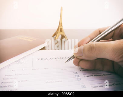 Filling Visa application form for France Paris Stock Photo