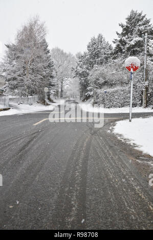 A slippery and dangerous road with a crossroad Stock Photo