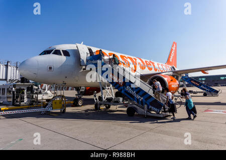 Passengers boarding EasyJet plane at London Stansted Airport, England United Kingdom UK