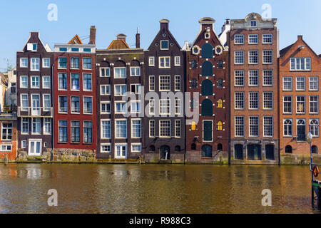 Traditional Dutch buildings at Damrak in Amsterdam, Netherlands Stock Photo
