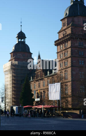 Aschaffenburg, Germany - November 17, 2018: Umbrellas of wine stands with visitors in front of Schloss Johannisburg on November 17, 2018 in Aschaffenb Stock Photo