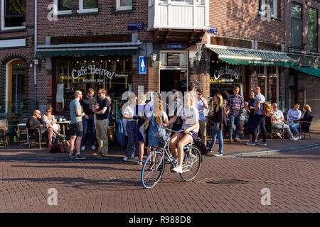 Young people enjoy summer weather in Amsterdam, Netherlands Stock Photo