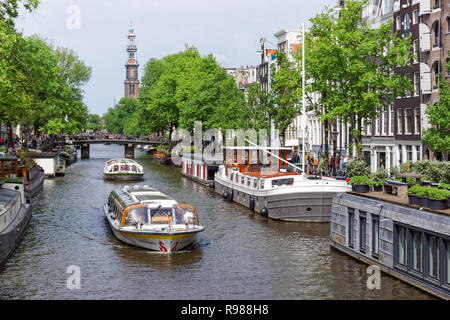 Tourist cruise boats on Prinsengracht canal in Amsterdam, Netherlands Stock Photo