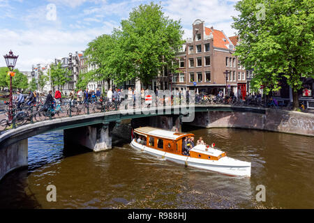 Tourists at Prinsengracht canal in Amsterdam, Netherlands Stock Photo