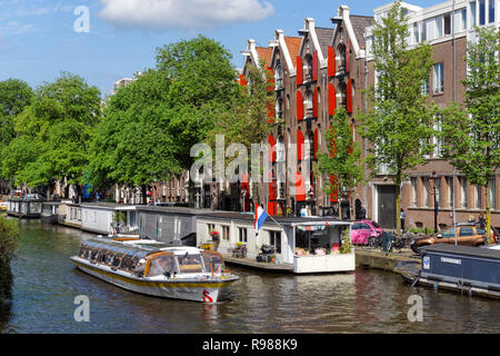 Tourist cruise boat on Prinsengracht canal in Amsterdam, Netherlands Stock Photo