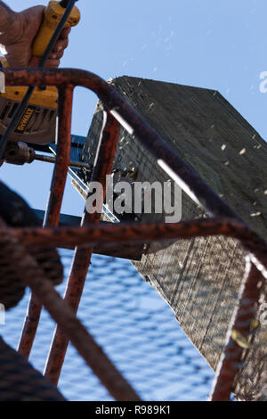 Man Using Electric Drill Stock Photo