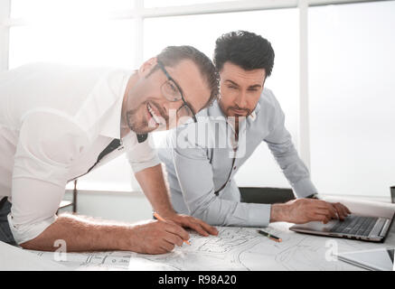 close up.architects make sketches in the workplace. Stock Photo