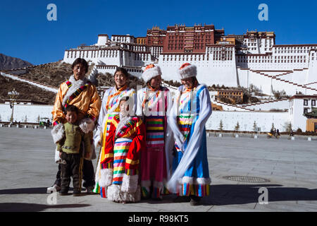 Lhasa, Tibet Autonomous Region, China : Young Tibetan women try out traditional costumes next to Potala palace. First built in 1645 by the 5th Dalai L Stock Photo