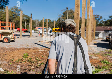 Construction Worker Using Optical Level Stock Photo