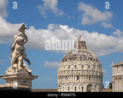 statue of cherubs with the Baptistery (Baptistery of San Giovanni) Pisa, on the Piazza dei Miracoli (Square of Miracles) in Pisa Tuscany, Italy Stock Photo