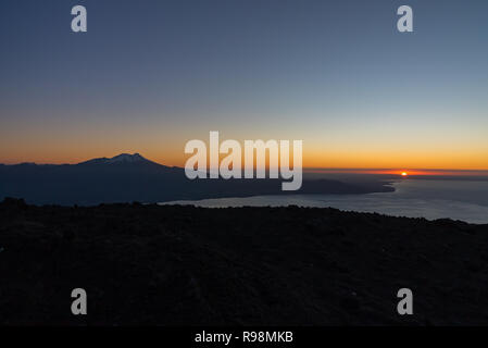 Aerial view with drone from the ski center in the volcano Osorno, Puerto Varas. With Lake Llanquihue and the Calbuco Volcano at sunset Stock Photo