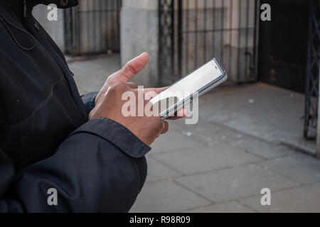 Closeup of mans fingers using a Mobile Phone Stock Photo