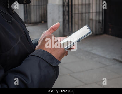 Closeup of mans fingers using a Mobile Phone Stock Photo