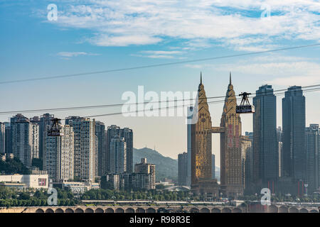 CHONGQING, CHINA - SEPTEMBER 19: View of the Ropeway of the Yangtze river, a famous cable car which crosses the river with city buildings in the backg Stock Photo