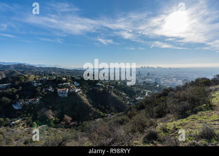 Clear morning view on canyon homes, Hollywood and downtown Los Angeles from hiking trail at Runyon Canyon Park. Stock Photo