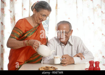 aged couple sitting together, MR. NO. 318, 319 Stock Photo