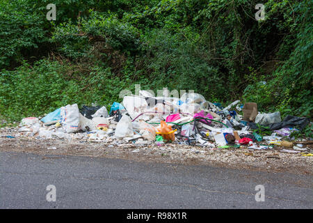 ROME, Italy - June 21, 2018: garbage abandoned in the countryside near the road Stock Photo