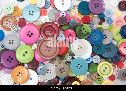 multi-coloured collection of buttons on white background Stock Photo