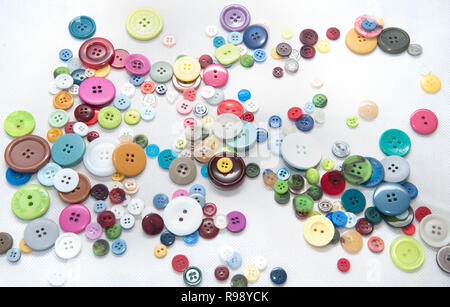 multi-coloured collection of buttons on white background Stock Photo