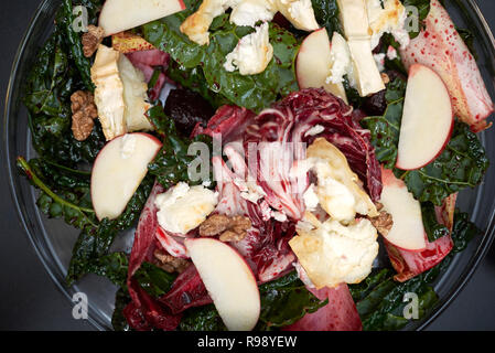 Beetroots leaves salad with hot goat cheese Stock Photo